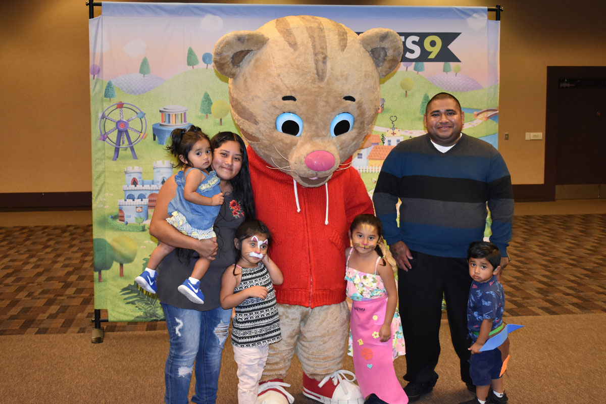 Family posing with Daniel Tiger