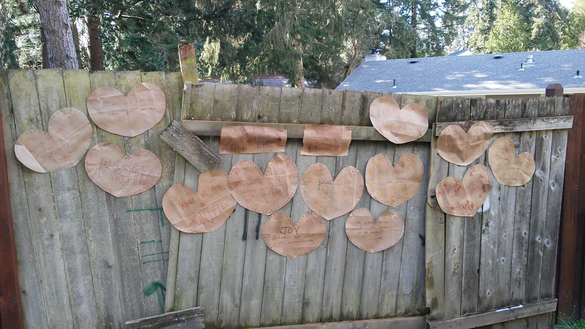 Heart shaped signs on a fence